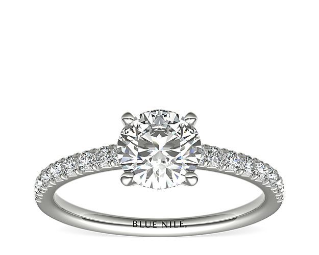 Eyes will be fixated on this immaculate platinum diamond engagement ring, showcasing French pavé-set diamonds that complement your choice of center diamond.