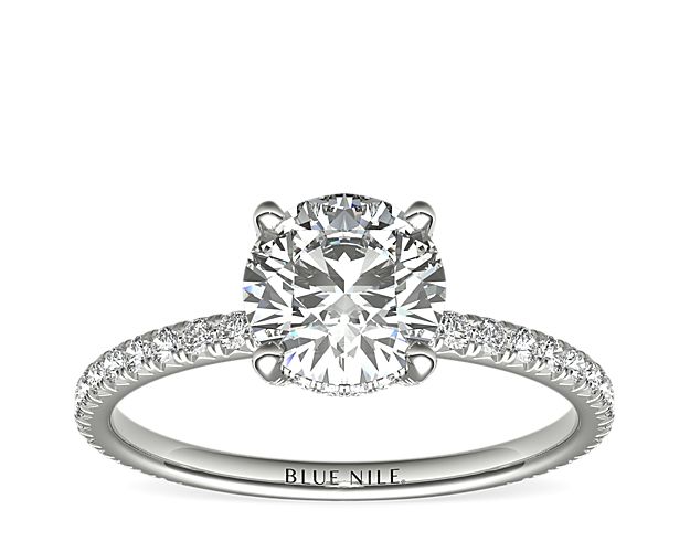 Beautifully crafted, this Blue Nile Studio platinum engagement ring features french pavé-set diamonds encompassing the center diamond of your choice.