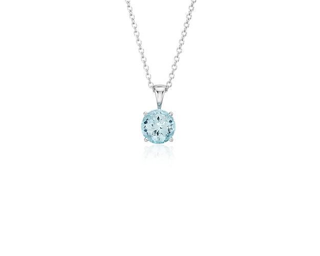 Vibrant and colorful, this gemstone pendant features a shimmering pale blue aquamarine set in a 14k white gold four-prong setting suspended from a dainty 18-inch cable chain. A classic piece of everyday luxury and is the birthstone for March.