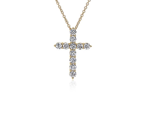 Let your faith sparkle and shine when you wear this cross necklace crafted in 14k yellow gold. The cross is beautifully set with stunning lab grown diamonds that catch the light for a radiant effect.