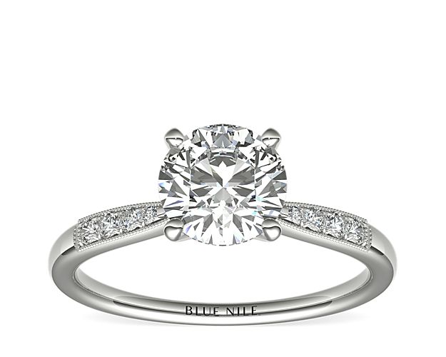Complement your center diamond perfectly with this platinum engagement ring accented with pavé-set diamonds along the shank.