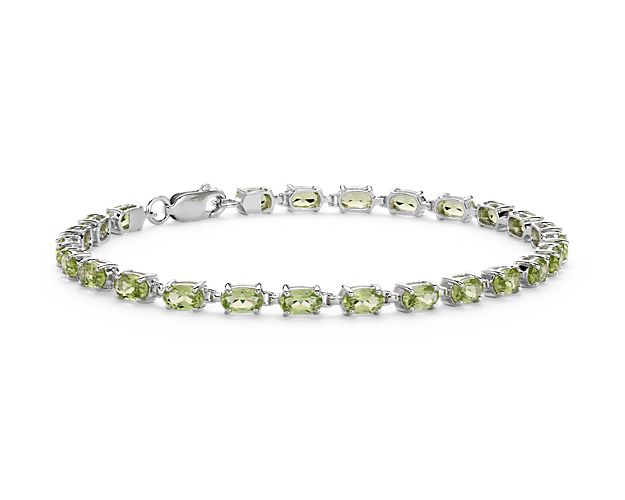Truly bright and festive, this gemstone bracelet features vibrant peridot gemstones framed in a delicate sterling silver setting.
