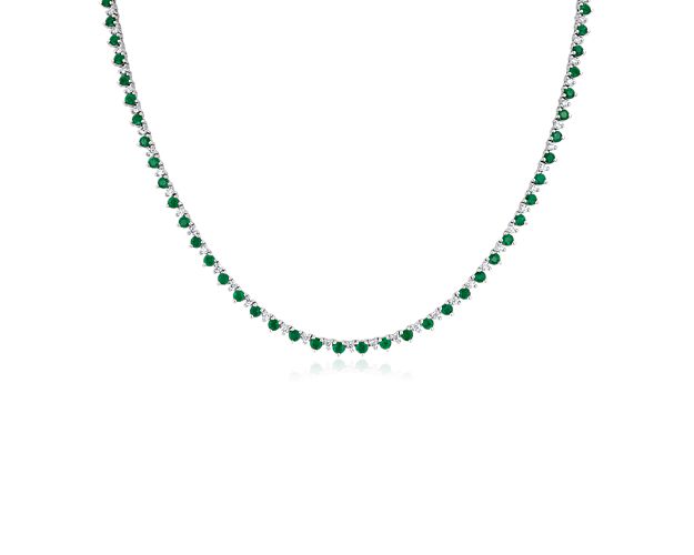 Sparkle through the room as you wear this 14k white gold eternity necklace featuring deep green emeralds and more petite diamonds alternating along the chain. It lies comfortably flat and is flexible to move with you.