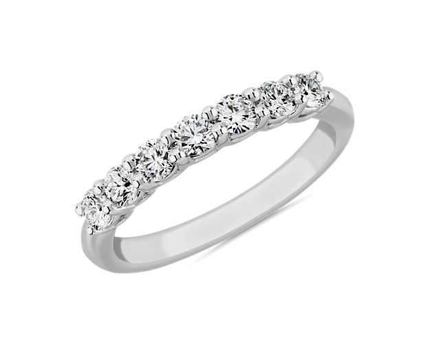 Go for timeless romance with this stunning ring featuring seven lab-grown diamonds shimmering along it. The 14k white gold low dome design gives it a comfortable feel on your hand.