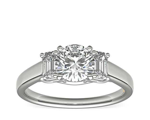 Simple with a touch of vintage, this platinum engagement ring that will complement the center diamond of your choice. Zac infuses luxurious style by adorning each ring with a signature 18k yellow gold interior accent.