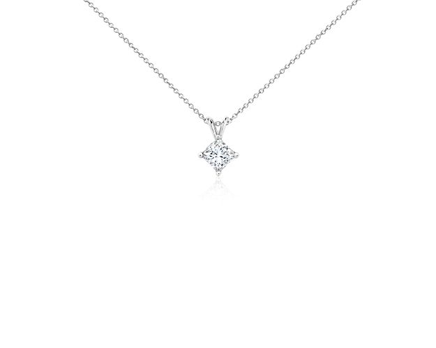 A near-colorless princess cut diamond is secured at the corners by 18k white gold prongs. An 18k white gold bail suspends the pendant from an 18k white gold cable-link chain. 1.5 carat total diamond weight. Accompanied by either a GIA or GCAL diamond grading report.