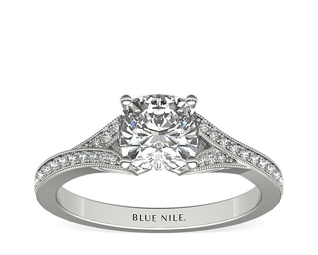 A v-shaped shank embellished with delicate milgrain detail and brilliant pavé diamonds creates an elegant showcase for the center stone of your choice.