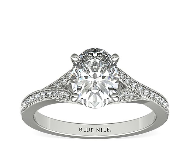 A v-shaped shank embellished with delicate milgrain detail and brilliant pavé diamonds creates an elegant showcase for the center stone of your choice.